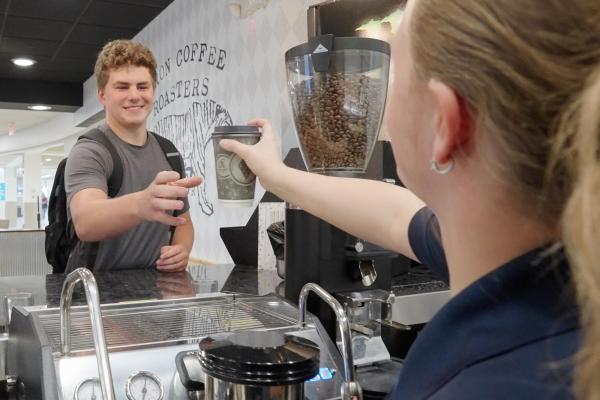 young man buying coffee